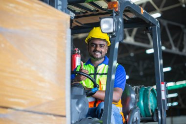 Forklift driver showing thumbs up, Worker on forklift, Manual workers working in warehouse, Worker driver at warehouse forklift loader works