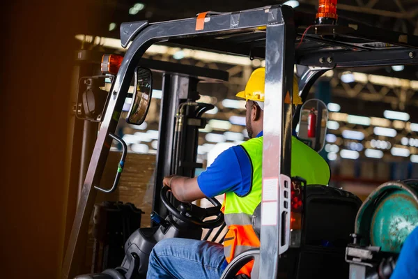 Worker on forklift, Manual workers working in warehouse, Worker driver at warehouse forklift loader works