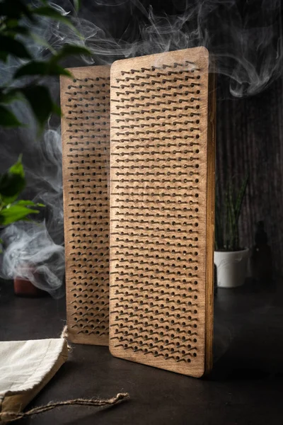 a board with sadhu nails for yoga classes. Standing on nails is an ancient Indian practice, during which work takes place on the physical, energetic and psychological levels.