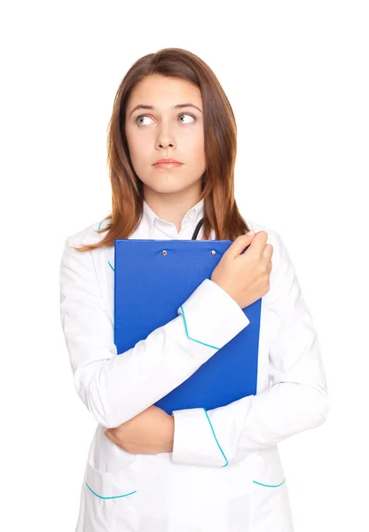Portrait of young female doctor holding clipboard isolated on wh — Stock Photo, Image