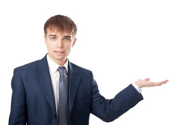 Retrato de jovem empresário apresentando um produto isolado em — Fotografia de Stock