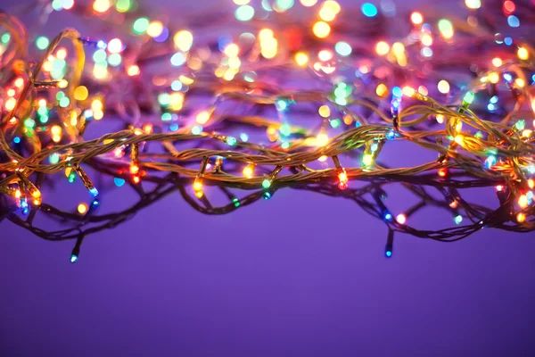 Christmas lights on dark blue background with copy space. Decora — Stockfoto