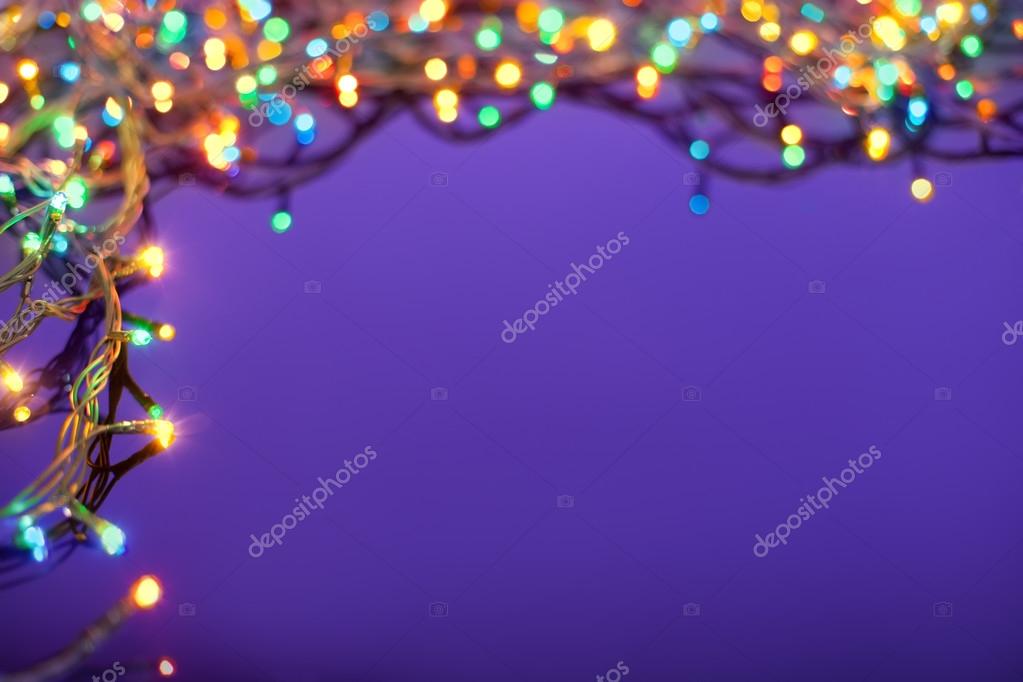 Christmas lights on dark blue background with copy space. Decora Stock  Photo by ©Gladkov 14075152