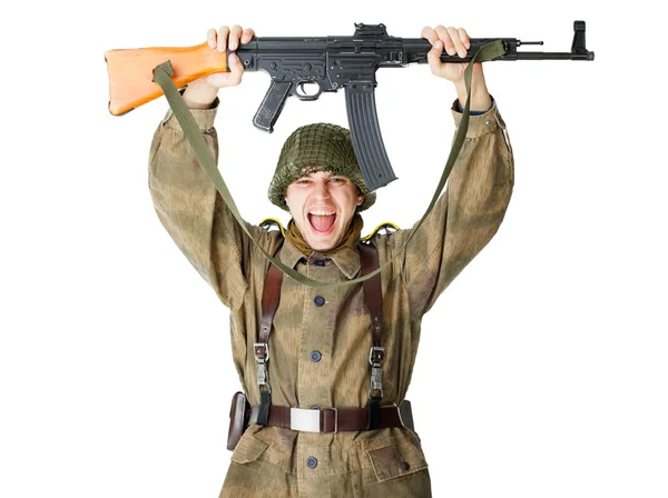 Soldat med maskingevær over hodet. – stockfoto