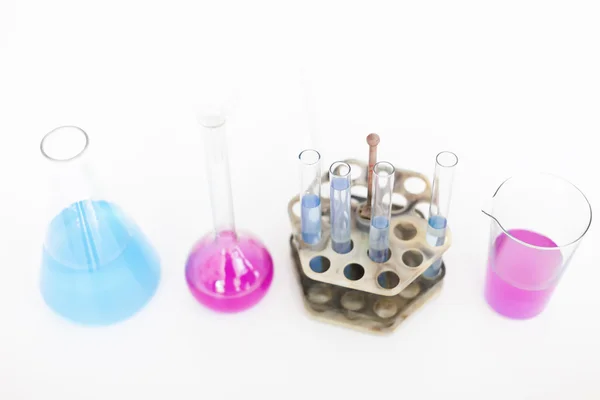 Chemical flasks with reagents on table — Stock Photo, Image