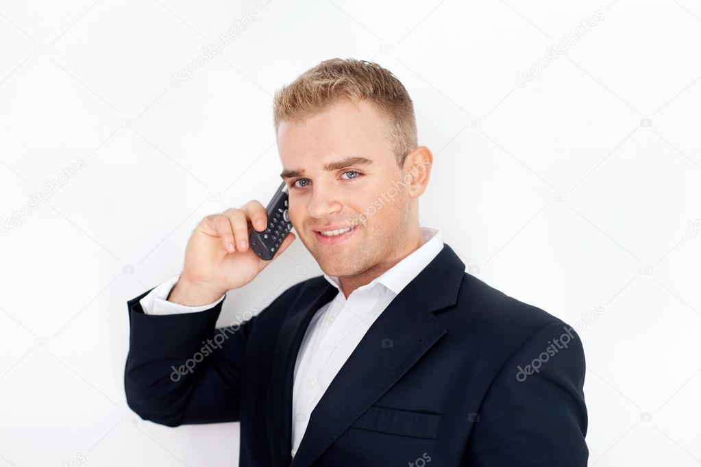 happy successful young business man talking on cell phone