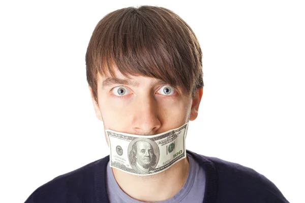 Portrait of young man with a 100 dollar banknote on his mouth is — Stock Photo, Image