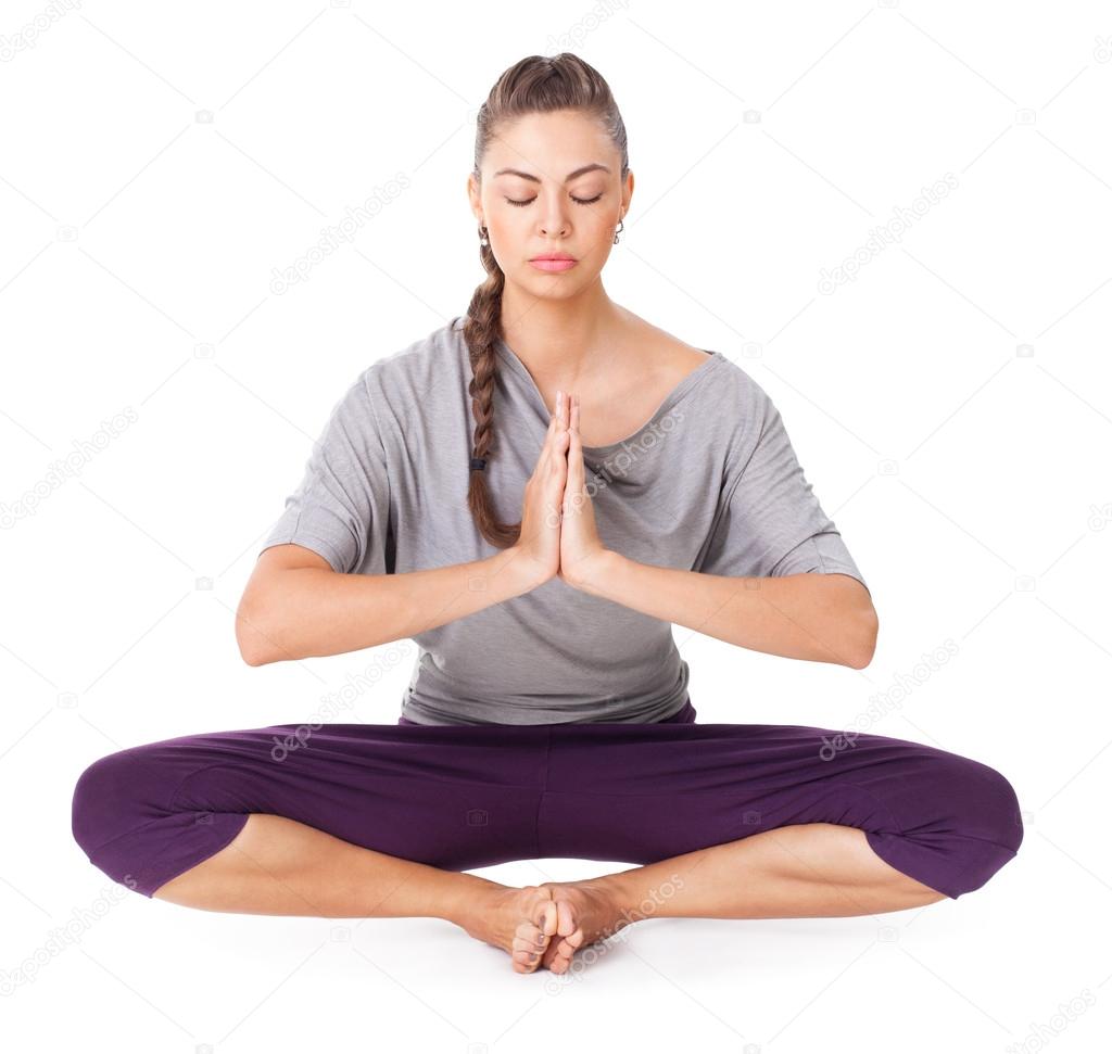 Young woman doing yoga asana Bound Angle Pose