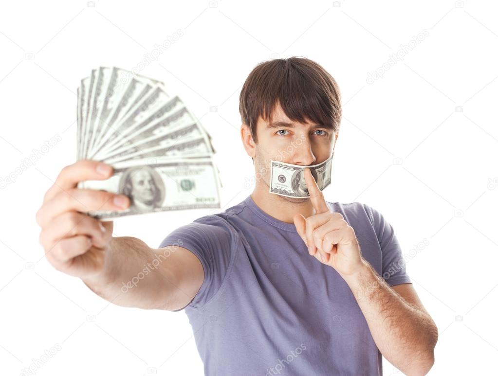 Young man holding a dollar bills his mouth sealed by hundred do