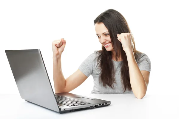 Young woman having success online on her laptop — Stock Photo, Image