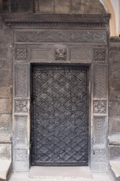 Old black metallic door — Stock Photo, Image