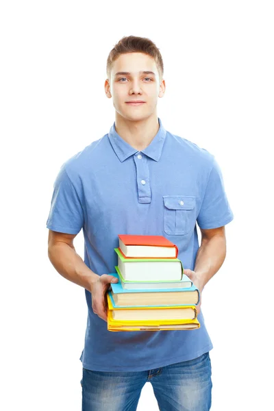 Retrato de estudante sorrindo segurando pilha de livros — Fotografia de Stock