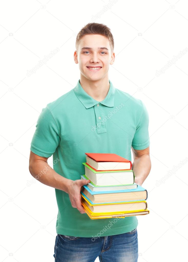 happy smiling student holding stack of books isolated on white