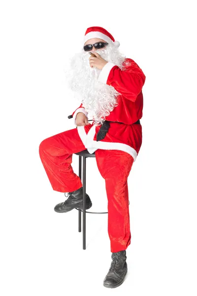 Santa claus dragen van een zonnebril en een sigaar roken — Stockfoto