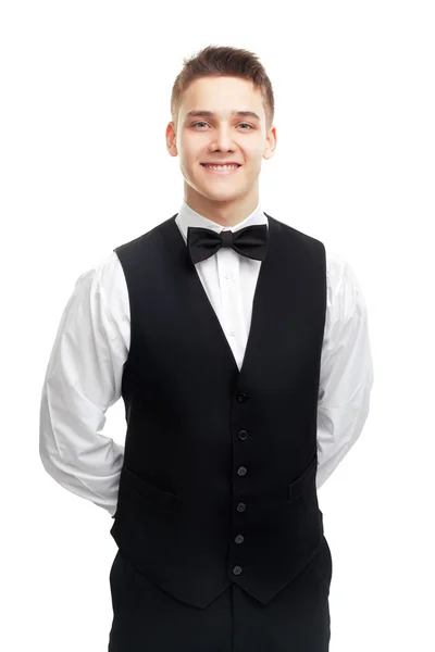 Unga leende servitör isolerad på vit bakgrund — Stockfoto