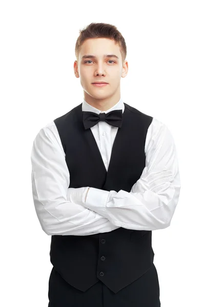 Молодой улыбающийся официант на белом фоне — стоковое фото
