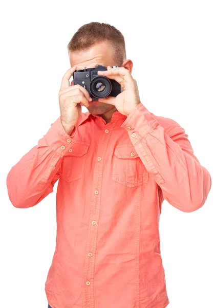 Junger Fotograf fotografiert mit seiner Kamera — Stockfoto