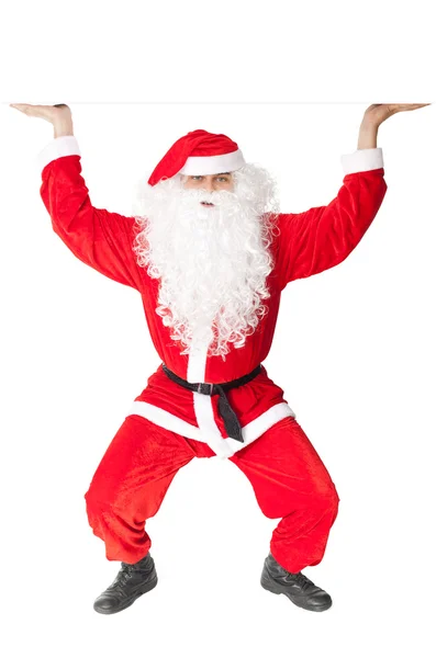 Санта-Клаус держит что-то над головой — стоковое фото