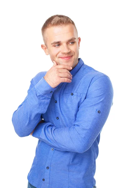 Joven vistiendo una camisa azul mira a un lado —  Fotos de Stock