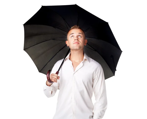 Young man under an umbrella — Stock Photo, Image