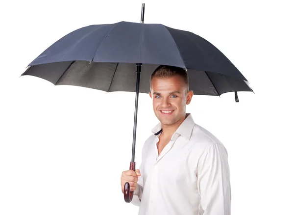 Young man under an umbrella — Stock Photo, Image