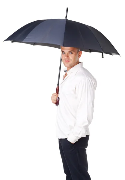 Young man under an umbrella — Stock Photo, Image