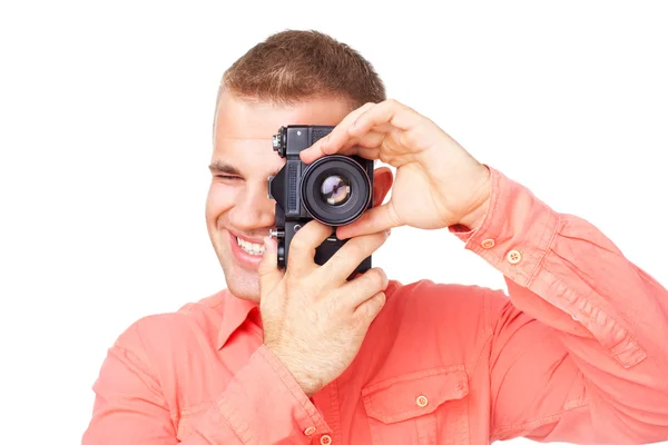 Jovem fotógrafo tirando fotos com sua câmera — Fotografia de Stock