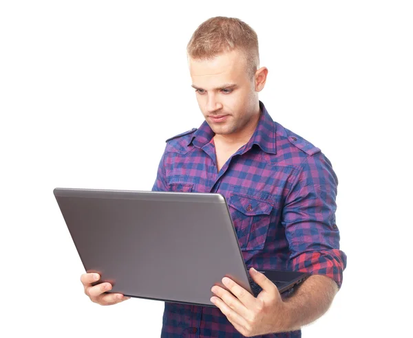 Hombre joven usando ordenador portátil — Foto de Stock