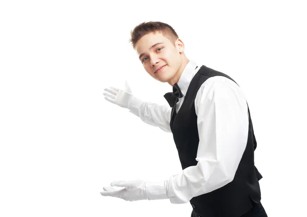 Unga glada leende servitör gestikulerande Välkommen — Stockfoto