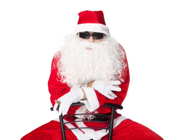 Santa Claus wearing sunglasses and smoking a cigar — Stock Photo, Image