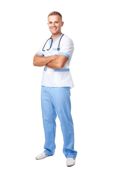 Happy smiling young doctor in uniform — Stock Photo, Image