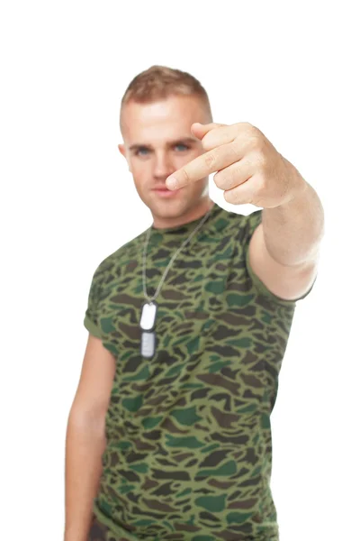 Young army soldier showing the middle fingers — Stock Photo, Image