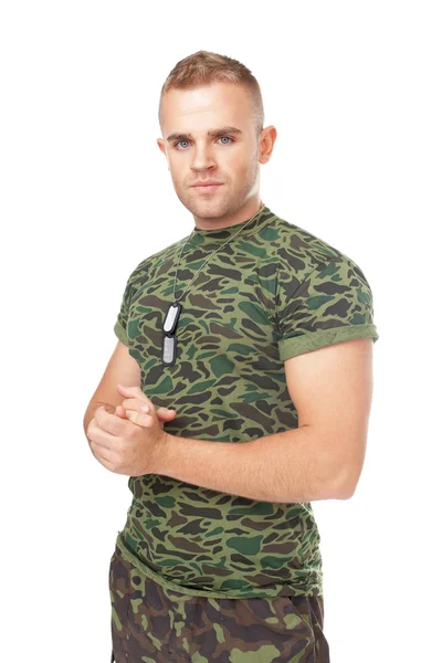 Young serious army soldier with military ID tags — Stock Photo, Image