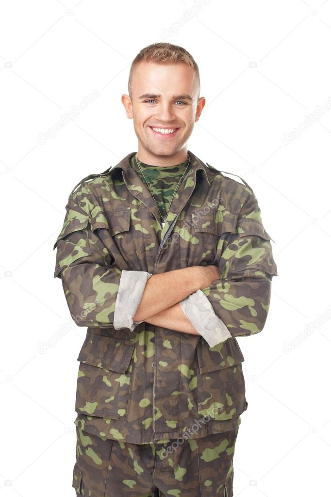 Smiling army soldier with his arms crossed