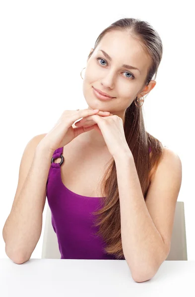 Young girl sitting at table — Stock Photo, Image