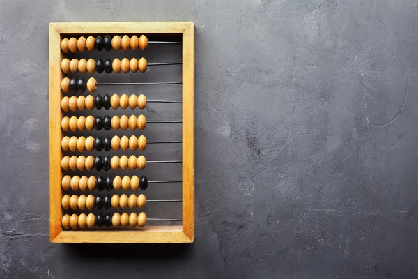 Accounting abacus on gray textured background — Stock Photo, Image