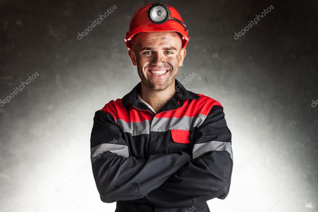 Happy smiling coal miner