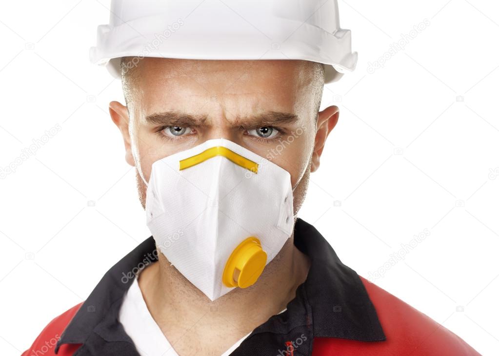Serious worker wearing respirator