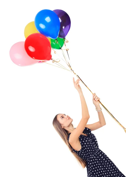 Νεαρή γυναίκα ευτυχισμένη με πολύχρωμα μπαλόνια — Φωτογραφία Αρχείου