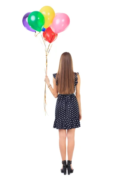 Bakifrån med kvinna med färgglada ballonger — Stockfoto