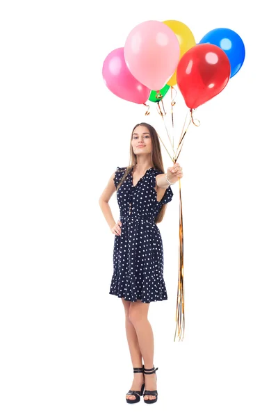Beautiful young woman offering colorful balloons — Stock Photo, Image