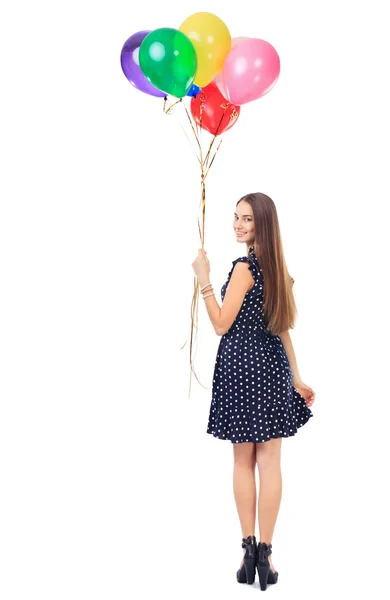 Kvinna med färgglada ballonger vända — Stockfoto