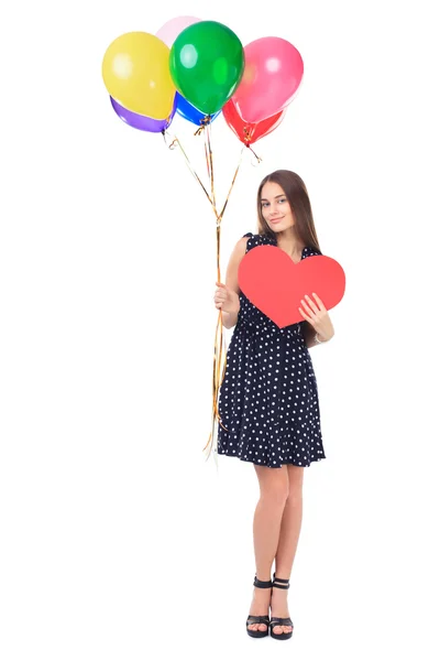 Mujer feliz con globos y corazón rojo — Foto de Stock