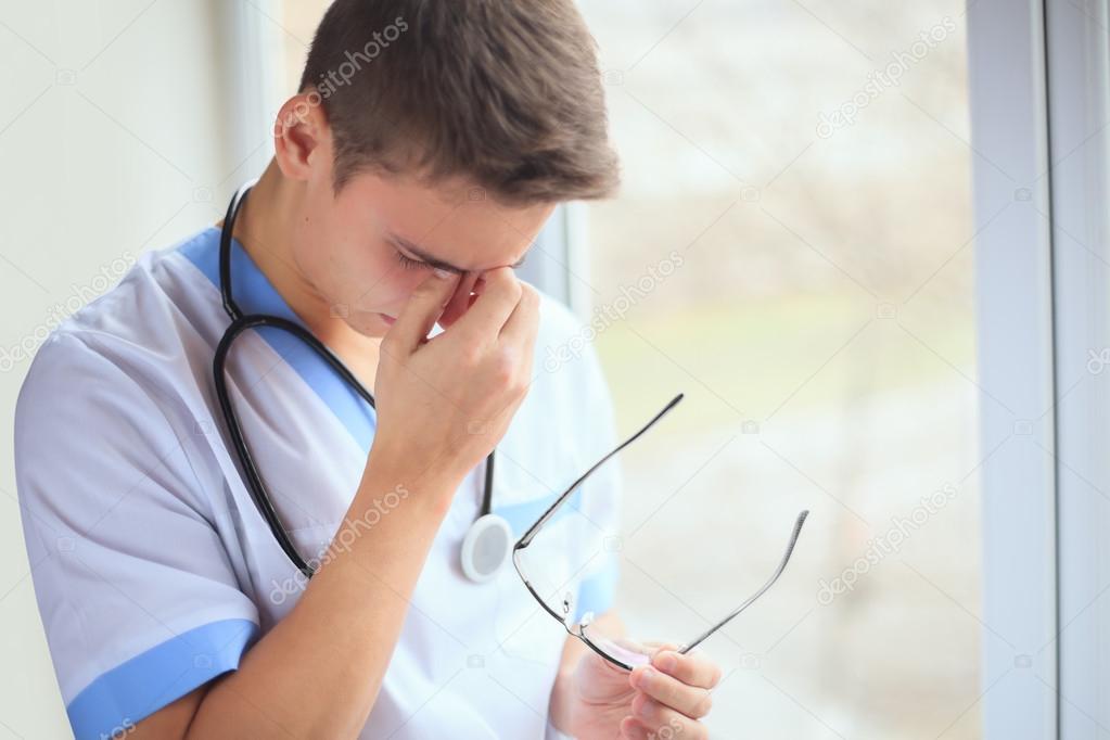 Tired young doctor