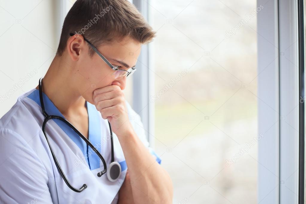 Young doctor thinking