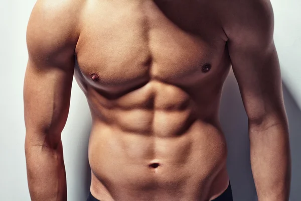 Muscular torso of young man — Stock Photo, Image