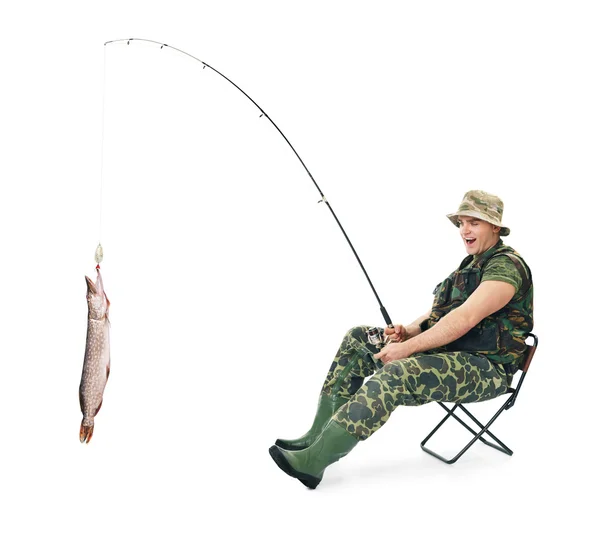 Fisherman in camouflage catching a fish — Stock Photo, Image