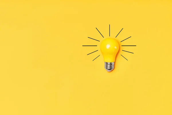 Concept creative idea with lightbulb on yellow background — Stock Photo, Image