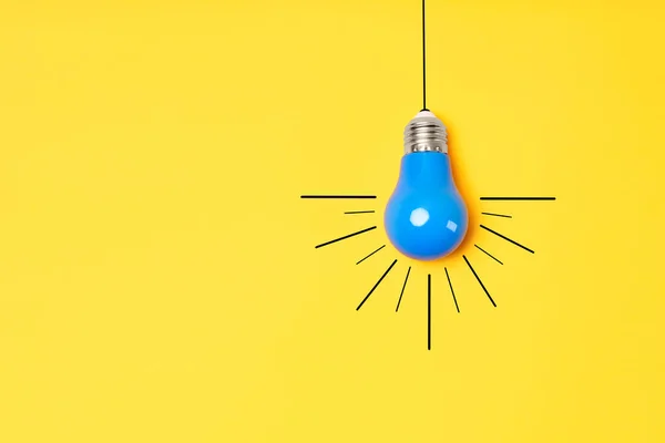 Concept creative idea with lightbulb on yellow background — Stock Photo, Image