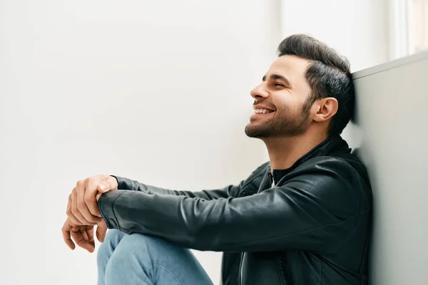 Portrait of happy smiling man posing on studio white background — стоковое фото